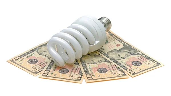Энергосберегающая лампочка и доллары США — стоковое фото