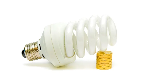 Energy saving light bulb and money Stock Picture