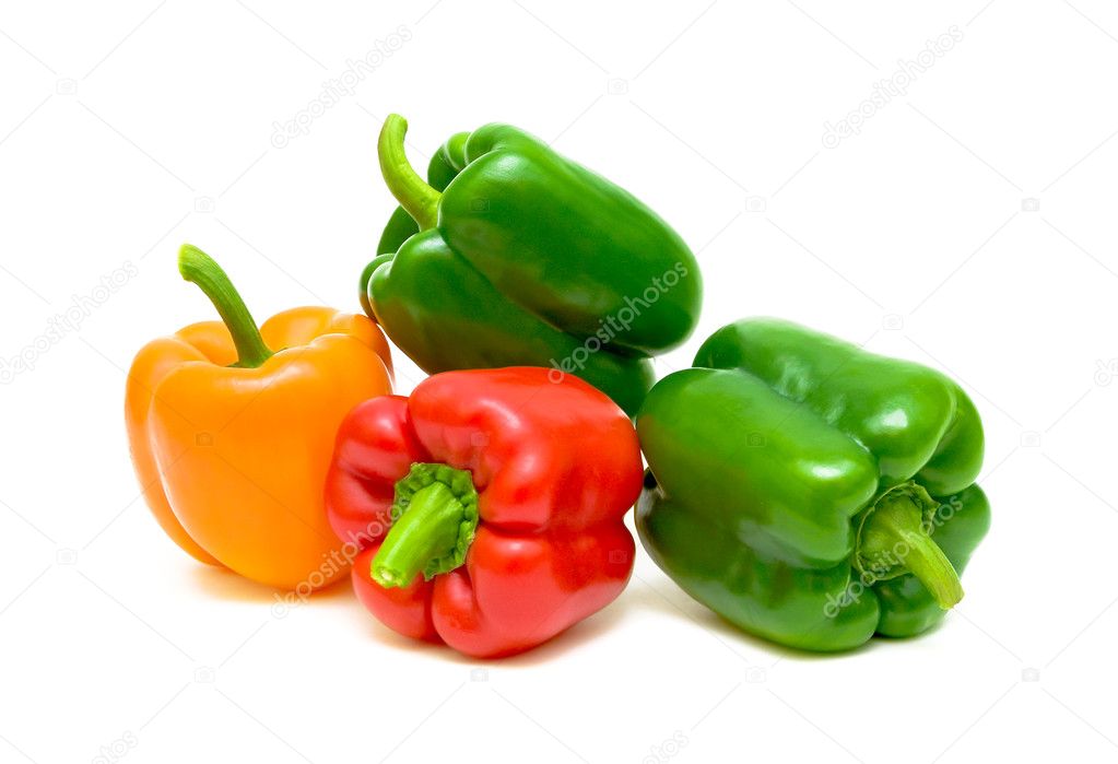 Four peppers closeup on white background