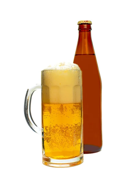 A glass of beer and a bottle — Stock Photo, Image