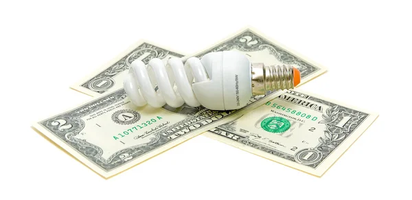 Fluorescent energy saving light bulb and U.S. dollars on a white — Stock Photo, Image