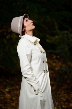 Attractive woman in evening autumn park