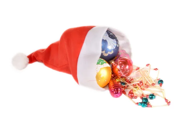 Christmas-tree decorations in a cap — Stock Photo, Image