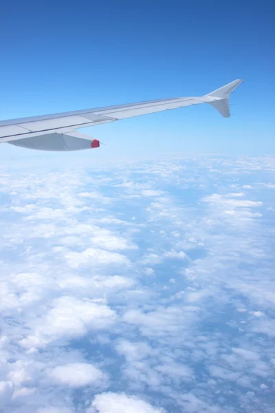 Clouds and blue sky seen from plane — Stock Photo, Image