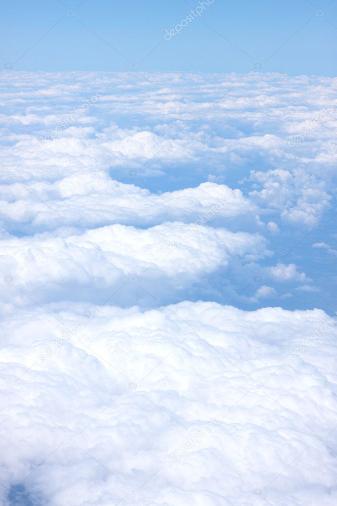 Clouds and blue sky seen from plane