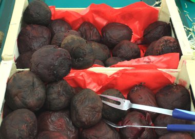 Red beet cooked on a market stall clipart