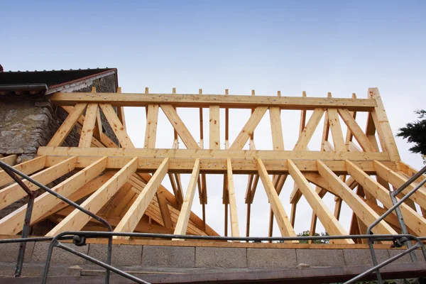 Construction of the wooden frame of a roof — Stock Image Construction of the wooden frame of a roof Stock Photo
