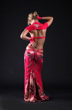 Beautiful belly dancer woman isolated black background clipart