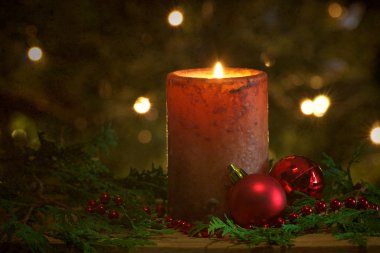 Christmas candle with sparkling lights. clipart