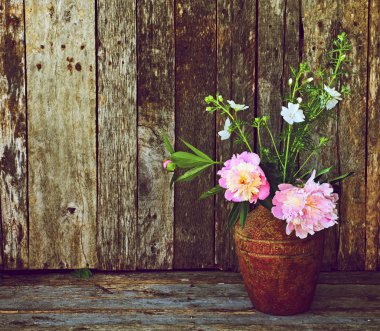 Richly colored flowers in vase still life. clipart