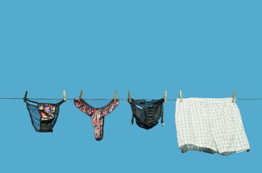 Panties and boxer shorts hanging. clipart