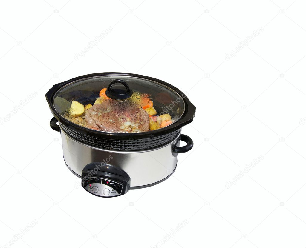 Slow cooker with roast beef and vegetables.