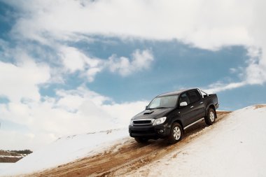 Pickup truck driving down the hill clipart