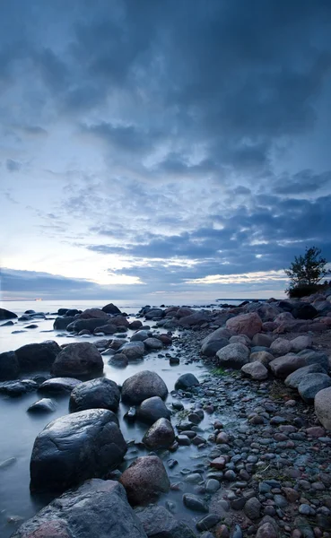 Stones in the sea after sunset — Stock Photo, Image