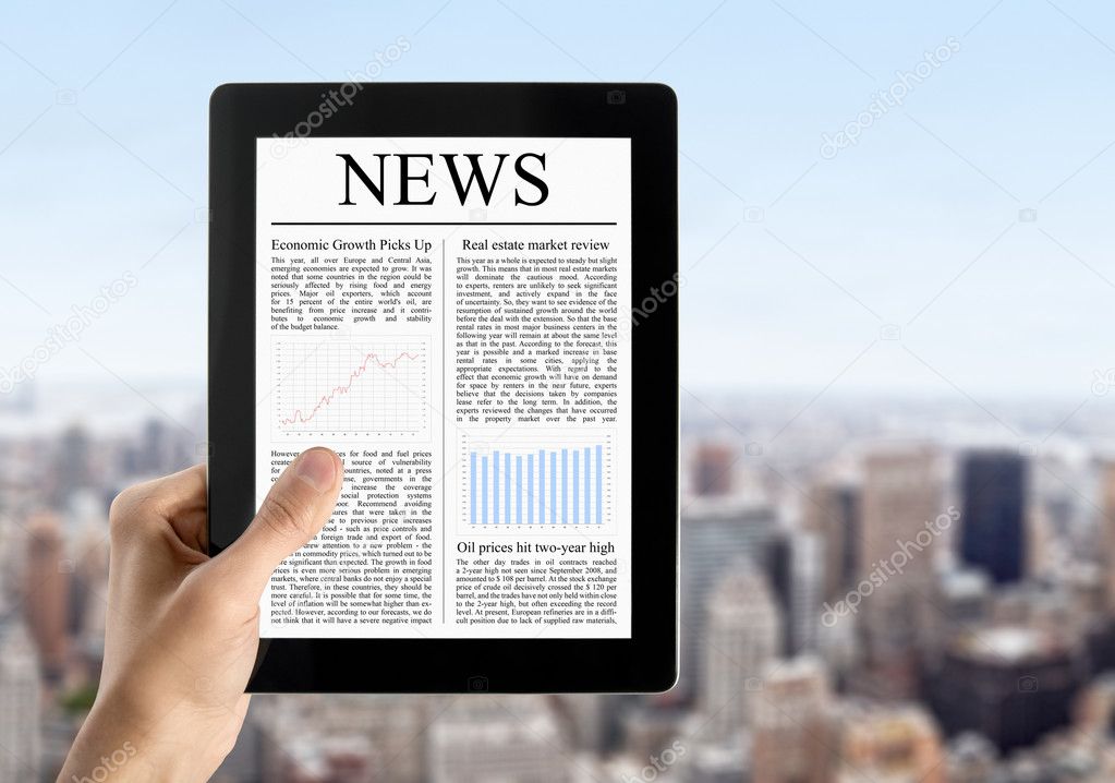 Hand Holds Tablet PC With News
