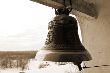 Old church bell. Sepia. clipart