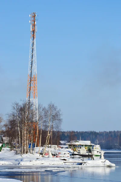 Communication tower on coast Svir riiver Stock Photo