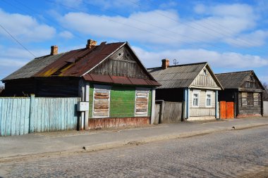 Rural street with abandoned houses clipart