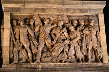 The bas-relief on the column in Victory Square at night, Minsk clipart