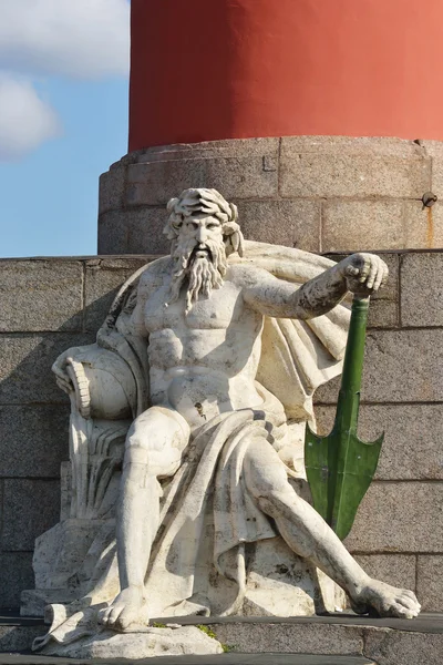 Statue at pedestal of Rostral Column in St.Petersburg — Stock Photo, Image