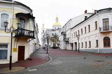 View of street in Vitebsk on a cloudy spring day clipart
