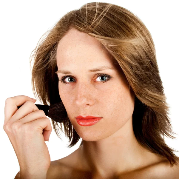 Vrouw gezicht met borstel — Stockfoto