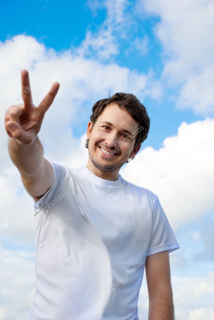 Man gesturing victory sign