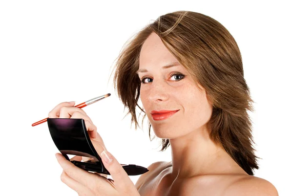 Kvinna ansikte med borste — Stockfoto