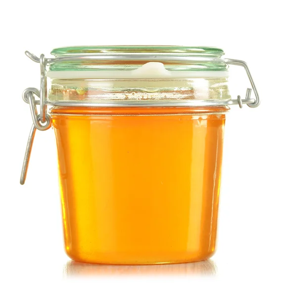 Jars of honey isolated on white — Stock Photo, Image