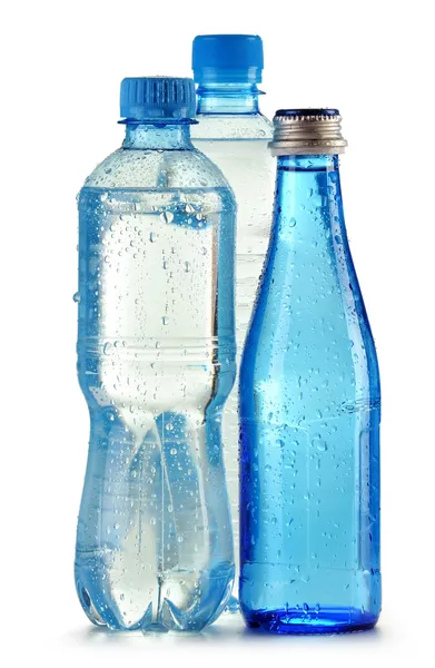 Polycarbonate plastic bottles of mineral water isolated on white — Stock Photo, Image