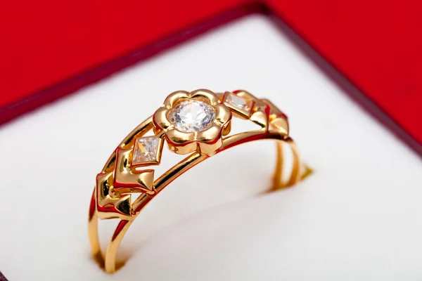 Gold ring with white zirconia enchased — Stock Photo, Image