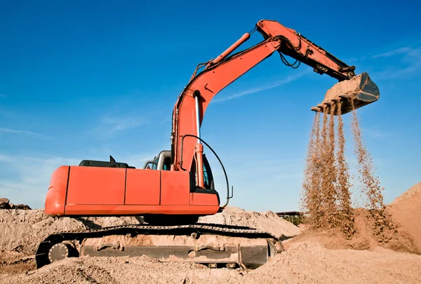 stock image Track-type excavator in sand quarry