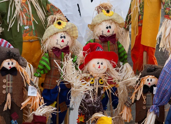 Smiling handmade cloth scarecrow dolls — Stock Photo, Image