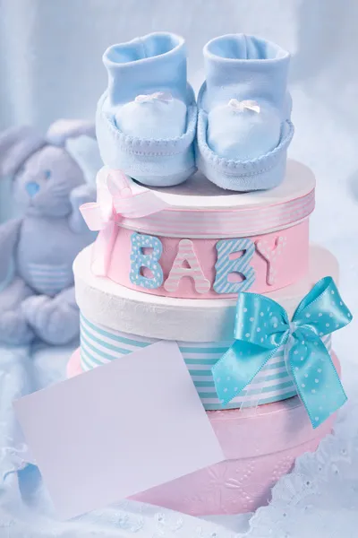 Little baby booties and gift boxes — Stock Photo, Image