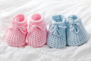 Blue and pink baby booties clipart