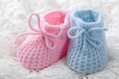 Blue and pink baby booties clipart