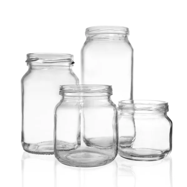Four empty glass jars — Stock Photo, Image