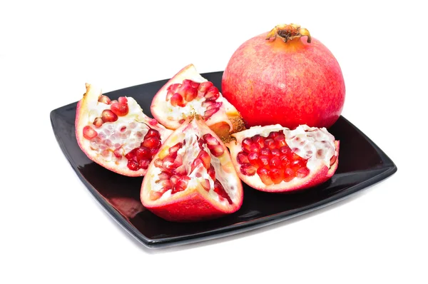 Stock image Fruit of pomegranate on a plate