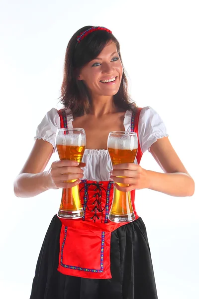 Flickan i en traditionell bayersk klänning Stockfoto
