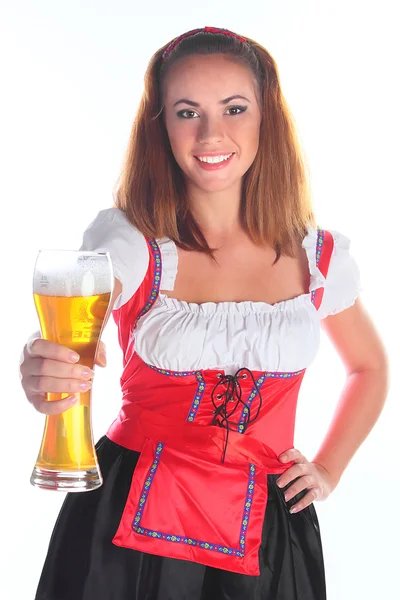 Flickan i en traditionell bayersk klänning Royaltyfria Stockbilder