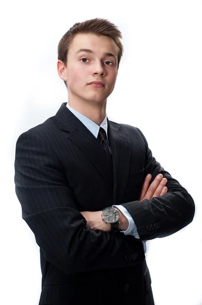 Jovem empresário confiante em um terno isolado em branco — Fotografia de Stock