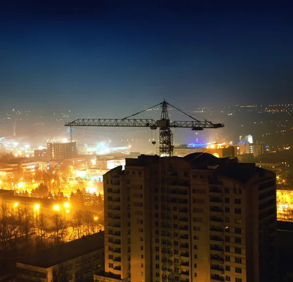 Stock image Night shot of construction equipment at building site