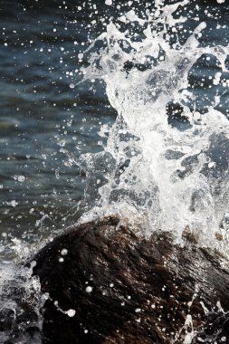 Water splashing on rocks clipart