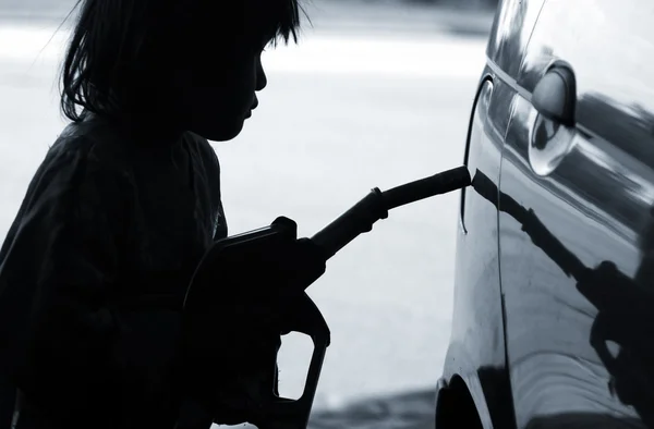 stock image Girl with fuel nozzle