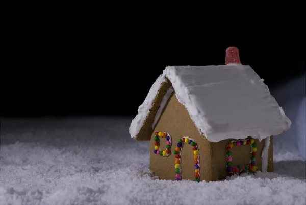 Christmas Gingerbread cottage at night — Stock Photo, Image