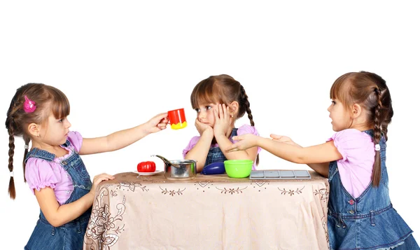 Children playing with plastic tableware — Stock Photo, Image