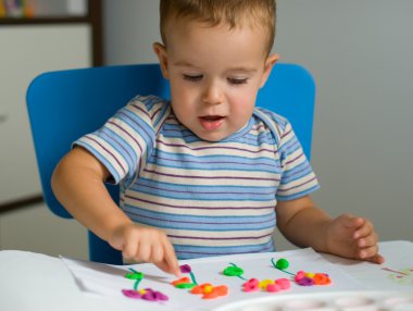 Boy and flowers of plasticine clipart