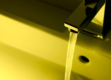 Chrome tap water in yellow clipart