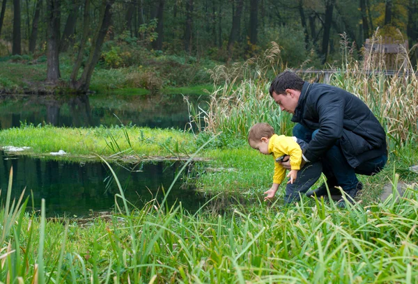 Father and son at the river — Stock Photo, Image