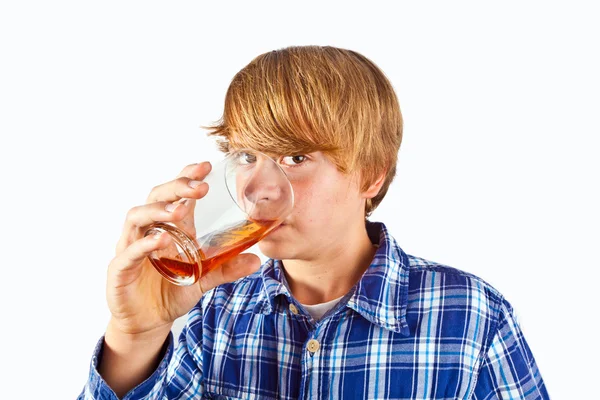 Boy drinking water out of a glass — Stock Photo, Image
